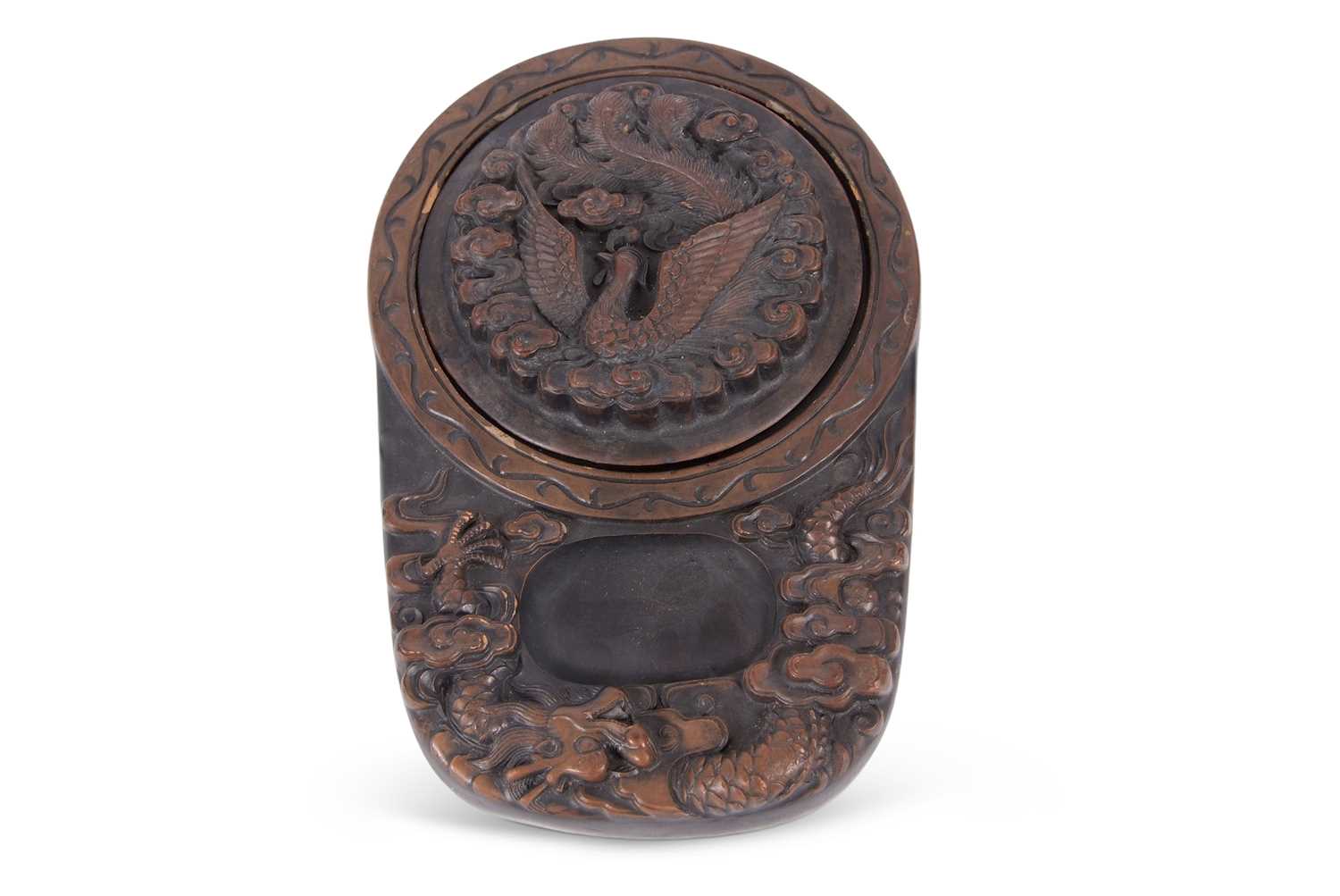 A Chinese carved box and cover, the cover incised with a peacock and the box with a dragon,