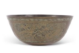 A Chinese brass bowl with incised dragon designs amongst panels of flowers, 25cm diameter