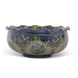 A Moorcroft Florian ware bowl made for Liberty with a Art Nouveau stylised floral design in green