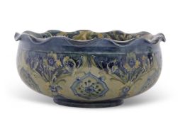 A Moorcroft Florian ware bowl made for Liberty with a Art Nouveau stylised floral design in green