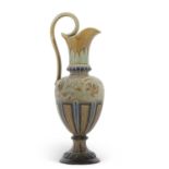 A Doulton Lambeth stone ware ewer by Emily Stormer with a incised design, loop handle, factory stamp