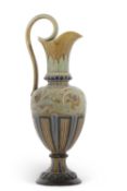 A Doulton Lambeth stone ware ewer by Emily Stormer with a incised design, loop handle, factory stamp