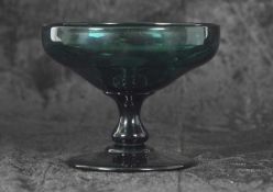 An early 19th Century Bristol green glass bowl raised on baluster stem and provenance with Gerald