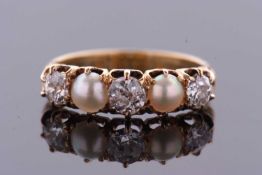 A five stone diamond and split pearl ring, the alternating old cut diamonds and split pearls,