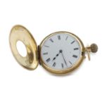 An 18ct gold half Hunter pocket watch stamped 18 inside of the case back and the front of the