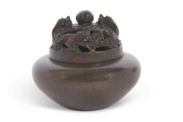 A Chinese bronze censer with pierced neck, finely carved with two opposing dragons