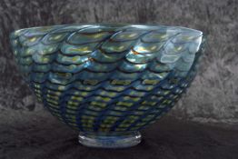 A Kosta Boda glass bowl with a swirl design in blue and yellow by Bertil Vallien etched signature to