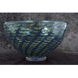 A Kosta Boda glass bowl with a swirl design in blue and yellow by Bertil Vallien etched signature to