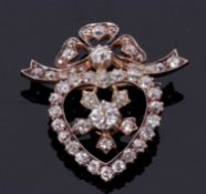 A late 19th/early 20th century diamond heart brooch, the open diamond set heart shaped frame set