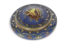 A Pilkington lustre bowl the blue ground with scrolling decoration as a cover with armorial sheld