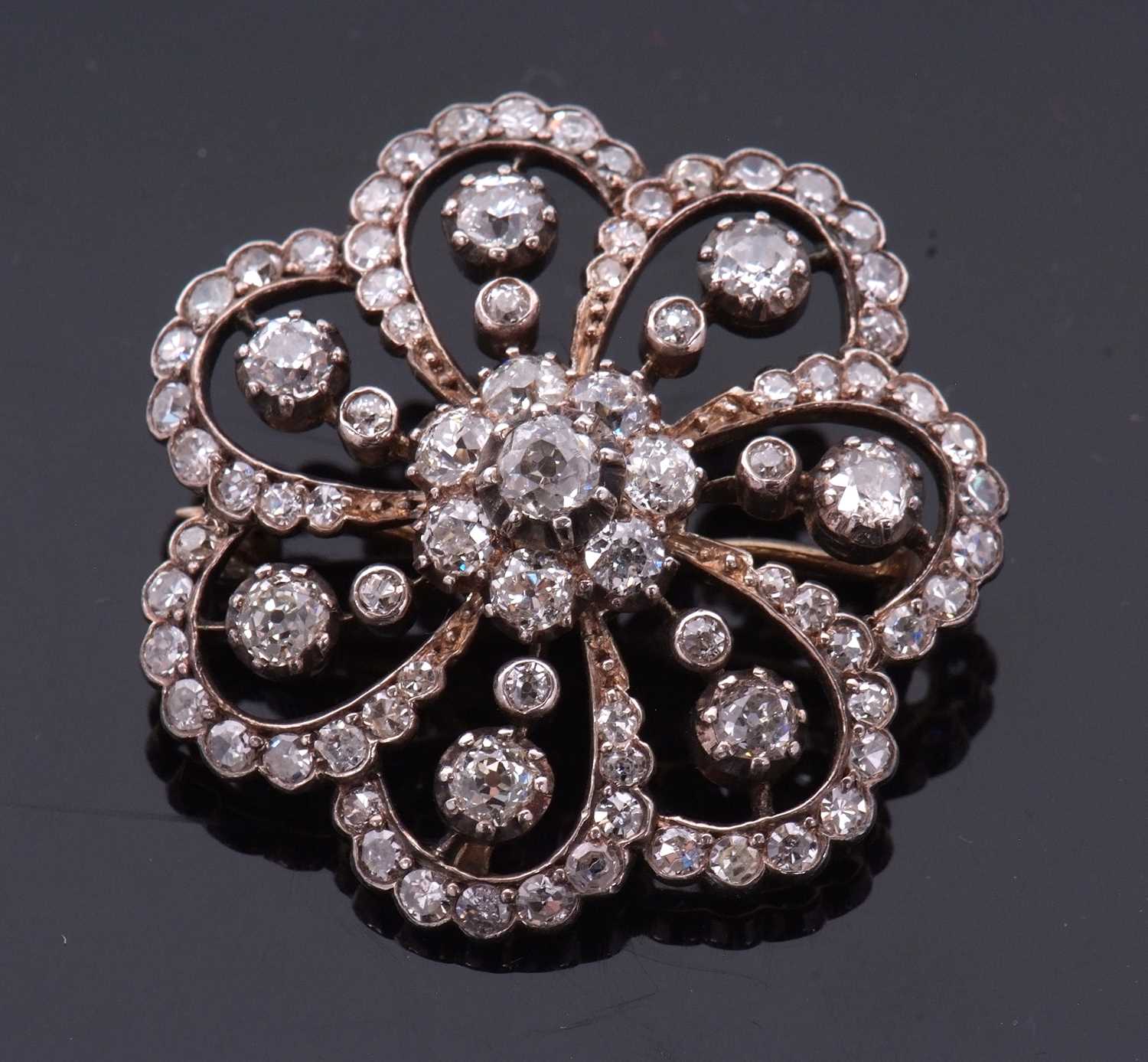 A late 19th/early 20th century diamond brooch, the central diamond flowerhead cluster, surrounded by - Image 6 of 8