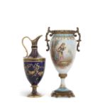 A late 19th Century continental porcelain sevres style vase with gilt metal mounts painted with a