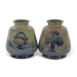 A good pair of Moorcroft vases in the Hazeldene pattern on an olive green ground early 20th century,