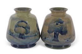 A good pair of Moorcroft vases in the Hazeldene pattern on an olive green ground early 20th century,