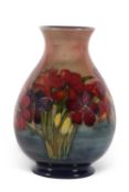 A mid 20th century Moorcroft vase of baluster shape decorated with the Spring Flowers pattern in a