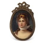 A small KPM style plaque finely painted with a portrait of a young lady in gilt scroll frame with