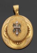 A Victorian emerald and seed pearl memorial pendant, the oval pendant set to centre with a cross