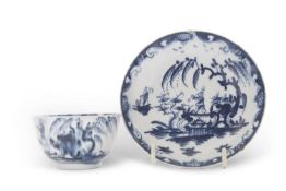 An early Lowestoft porcelain tea bowl and saucer with the boy on the bridge pattern, the saucer 12cm