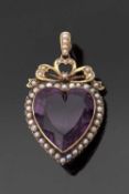 An Edwardian amethyst and pearl pendant, the mixed cut amethyst, collet mounted and surrounded by