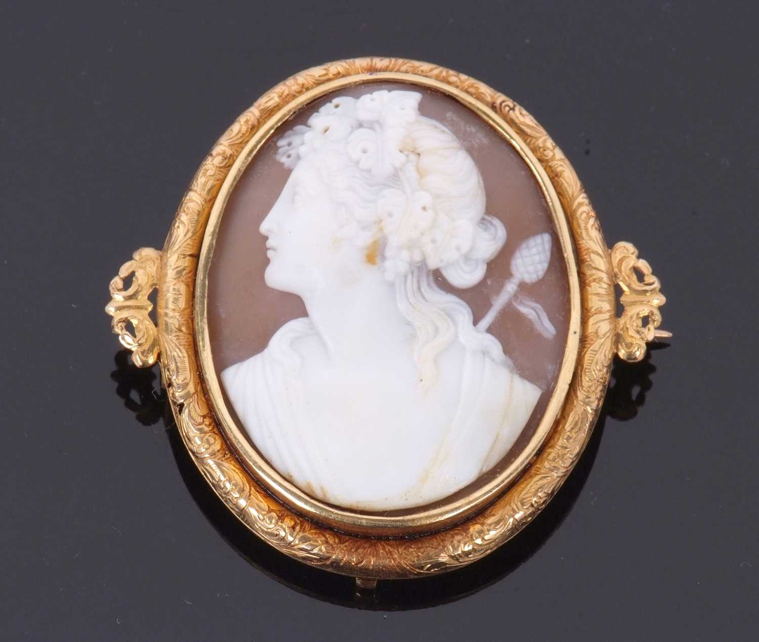 A cameo brooch, the oval shell cameo carved with the head of Dionysus, indistinctly initialled AJ to - Image 6 of 7