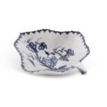 A Lowestoft porcelain pickle dish painted in blue and white with a fruiting vine design within berry