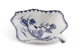 A Lowestoft porcelain pickle dish painted in blue and white with a fruiting vine design within berry