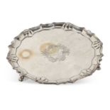 A George II silver salver of shaped circular form, shell and scroll border, engraved to the centre