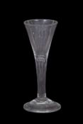Georgian wine glass, the trumpet bowl above a clear stem and domed foot, 15cm high