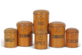 A set of early 20th Century metal kitchen storage tins with hinged lids, variously marked