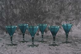 An unusual rare set of six William IV Bristol light green wine glasses each with trumpet bowl on a