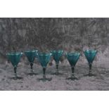 An unusual rare set of six William IV Bristol light green wine glasses each with trumpet bowl on a