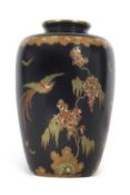 An early Carlton ware Famille Noire vase decorated in Art Deco style with a pheonix amongst