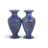 A pair of Bursley ware vases with a blue Art Deco type design, pattern number 585, probably designed
