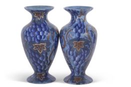 A pair of Bursley ware vases with a blue Art Deco type design, pattern number 585, probably designed