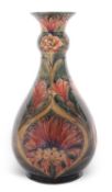 A good early 20th century Moorcroft vase of baluster shape with collar neck, decorated with the