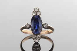 A sapphire and diamond ring, the oval mixed cut sapphire, approx. 12 x 7.5 x 5.7mm, claw mounted