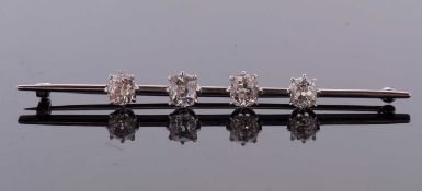 A four stone diamond bar brooch, the four old mine cut diamonds, total estimated approx. 3.50cts,