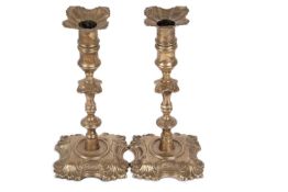 Pair of George II silver cast candlesticks, London 1748, makers mark for John Cafe, the shaped