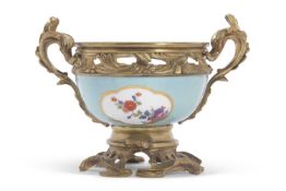A rare Meissen porcelain bowl circa 1740, the light blue ground with panels of Kakiemon style