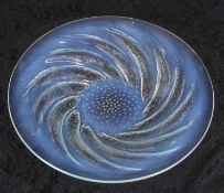 A Lalique poissons bowl with a design of fish, picked in blue opalenscence with bubbles to centre of