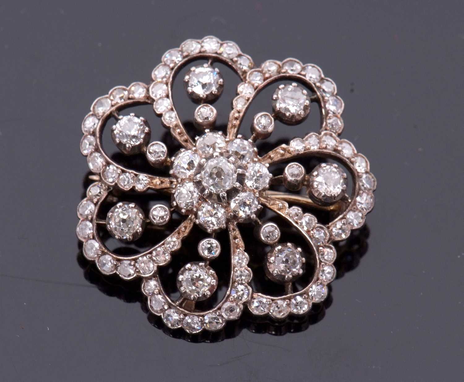 A late 19th/early 20th century diamond brooch, the central diamond flowerhead cluster, surrounded by - Image 8 of 8