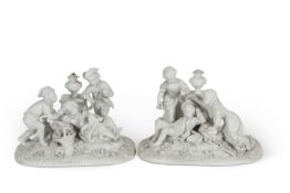 A pair of French Parian ware groups of children on oval bases with applied flowers, both with Sevres