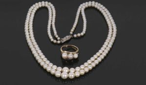 A two strand cultured pearl necklace by Mikimoto, the graduated cultured pearls between 3-7mm