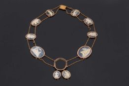 A Victorian shell and stone cameo necklace, set with 9 graduated blue/grey and white oval cameos,