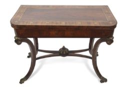 A Regency rosewood and brass inlaid card table with folding top opening to a baize lined interior,