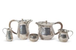 Sterling Silver Modernist tea service. comprising Teapot, Hot water jug, Sugar bowl, Cream and
