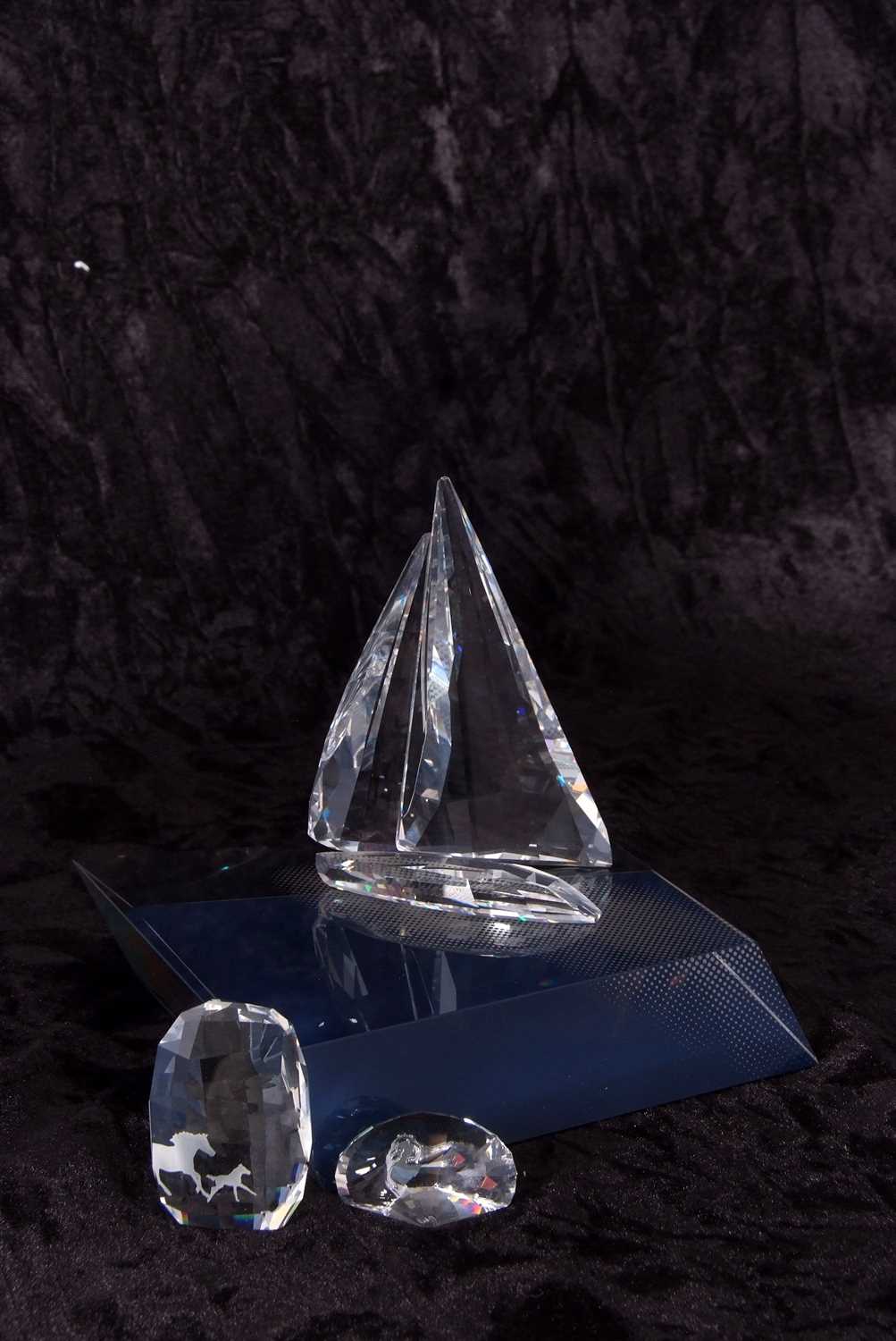 A Swarovski model of a yacht on fitted stand together with two small Swarovski paperweights, one - Image 2 of 4