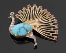 A multi gemset peacock brooch, the body set with an oval turquoise cabochon, with diamond neck and