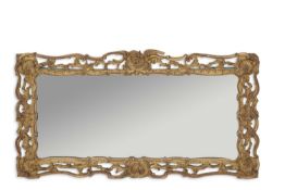 A 19th Century gilt framed rectangular wall mirror, the frame of pierced foliate form, labelled to