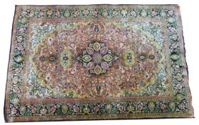 A mid 20th Century Persian silk qum ghom seide rug, decorated with a dark floral border and a